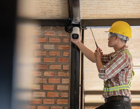 Technician installing CCTV camera for security.Technician worker installing video surveillance camera Technician installing CCTV camera for security.Technician worker installing video surveillance camera